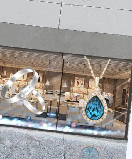 Vitrina de joyería con LED Film que muestra dos anillos y un collar con piedra azul